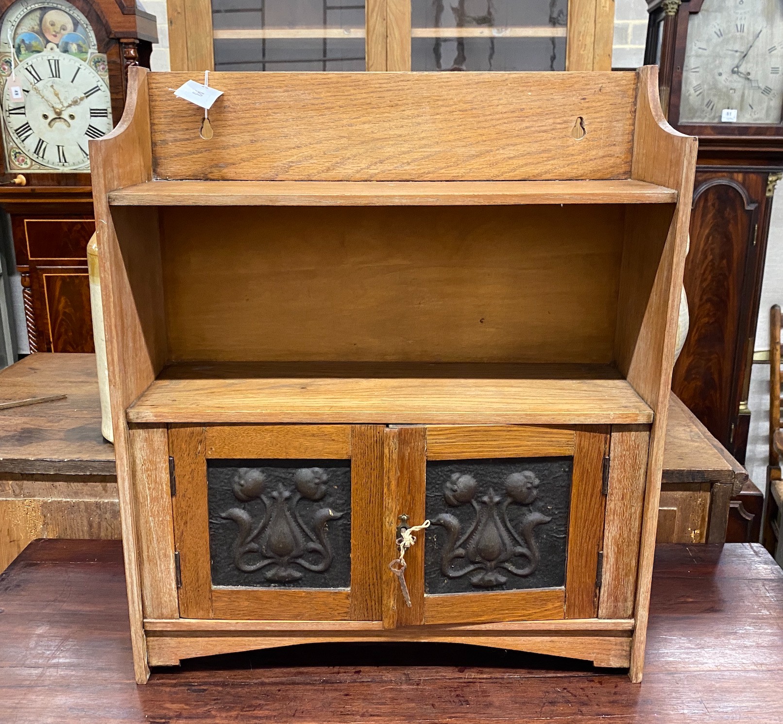 An Edwardian oak hanging wall cabinet, width 53cm, height 63cm